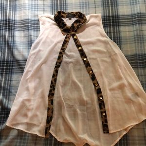 Sheer, see threw blouse with a cheetah liner.